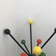 Wearing chrome parrot coat, black and multicolored balls