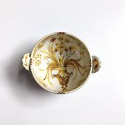 Vintage bowl signed Keraluc Quimper in yellow and green.