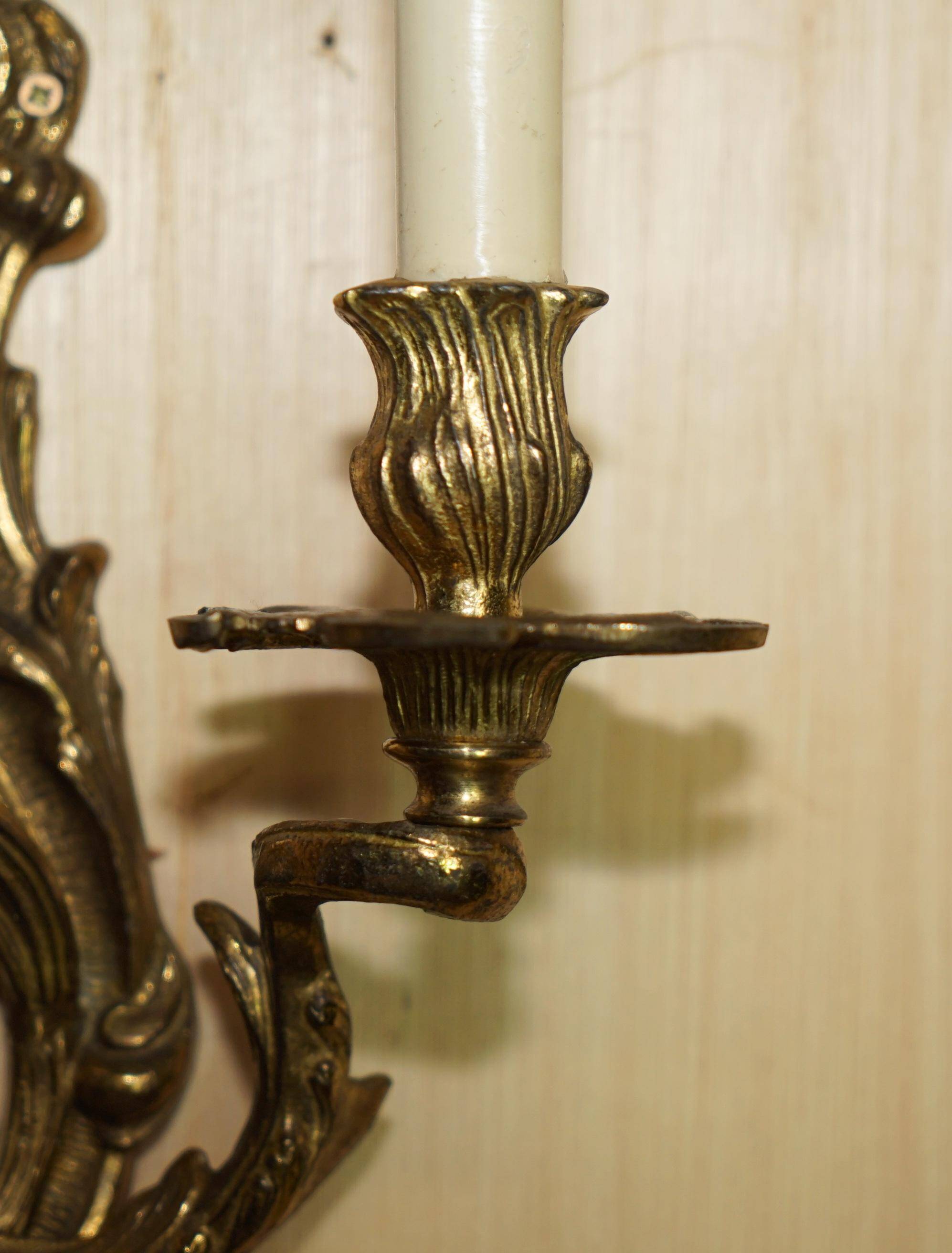 Pair of antique wall sconces from the 1920s in gilded bronze.