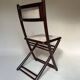 Set de quatre chaises pliantes en bois et cannage