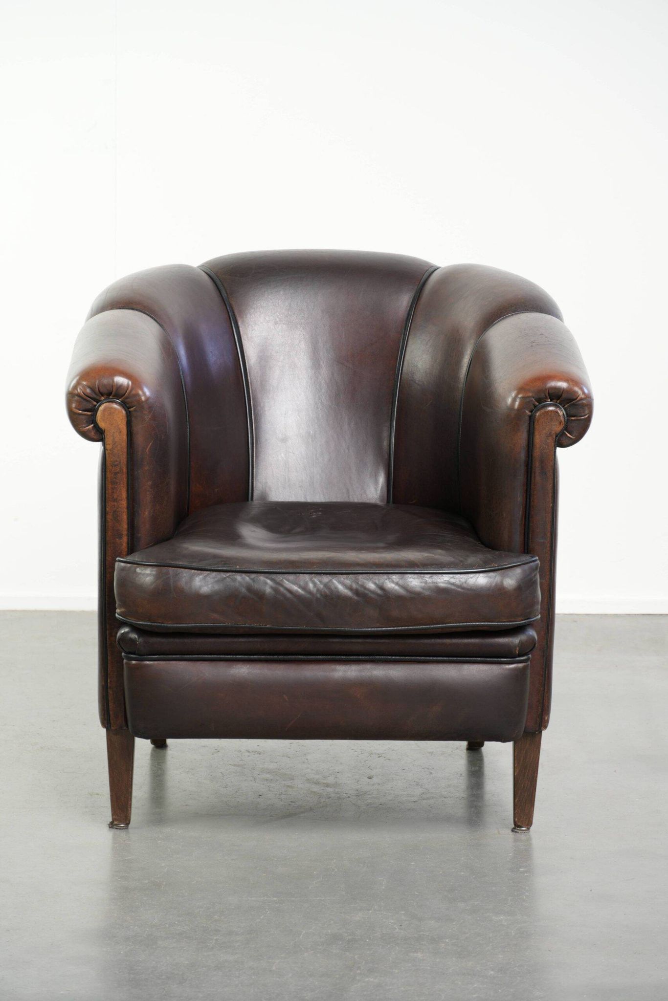 Dark sheepskin club armchair with unique design in English style