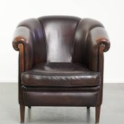 Dark sheepskin club armchair with unique design in English style