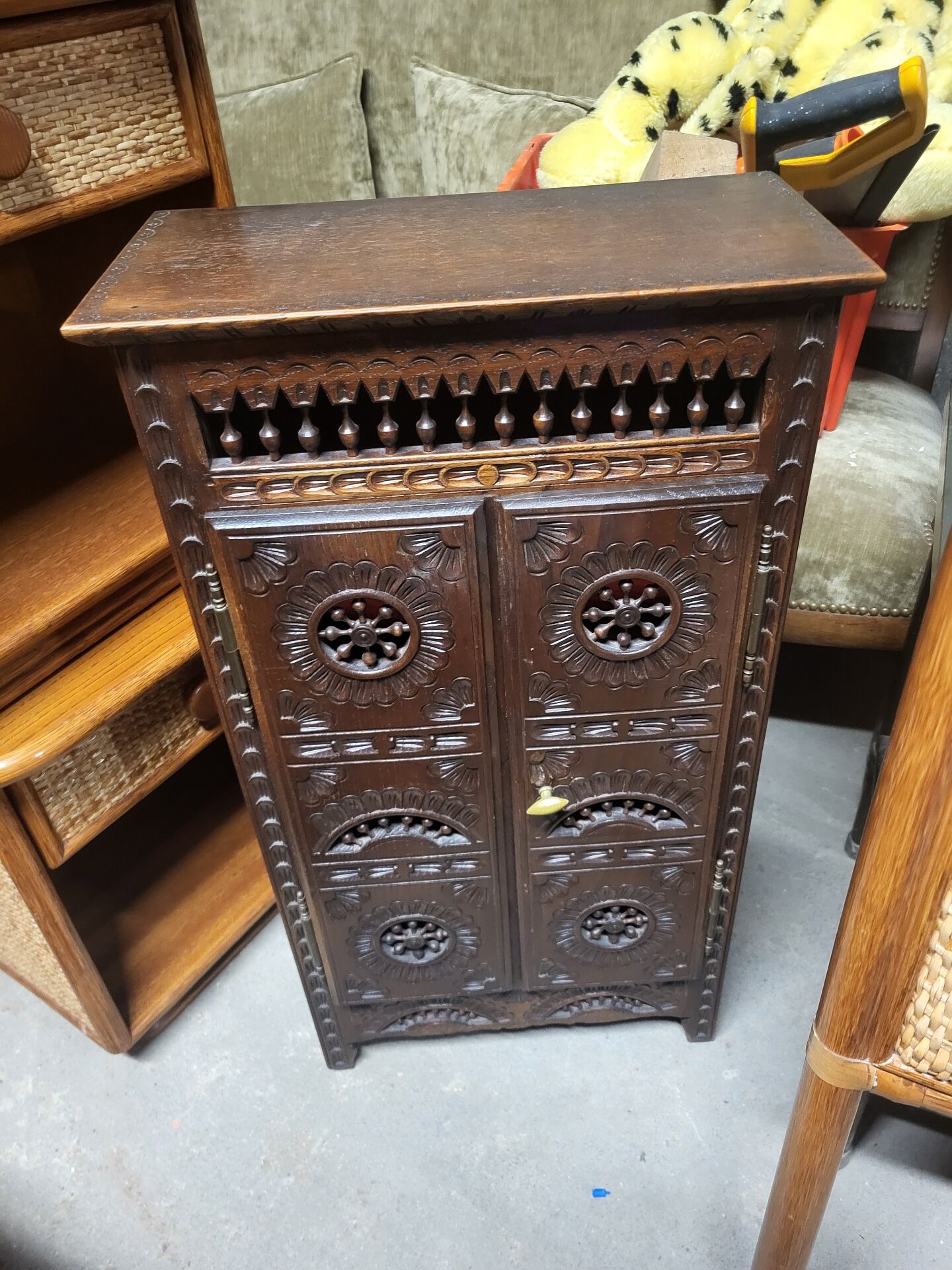 Small antique side table in carved wood.