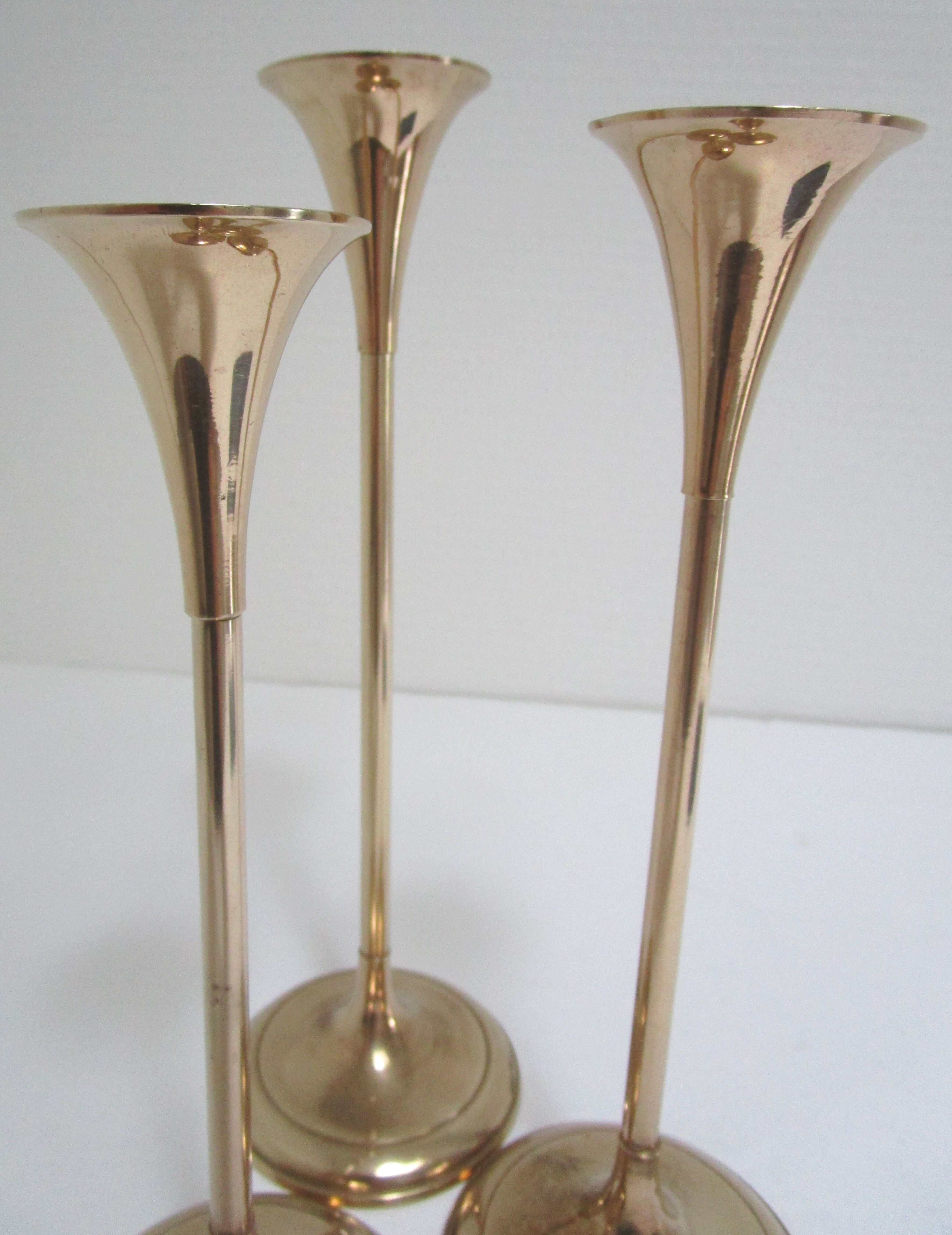 Trio of brass scandinavian candlesticks