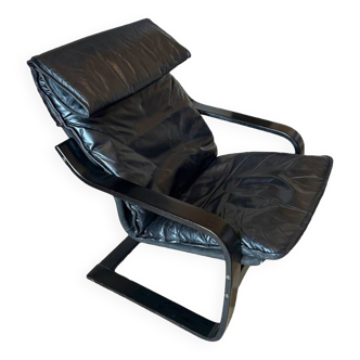 Fauteuil relax cuir noir années 70