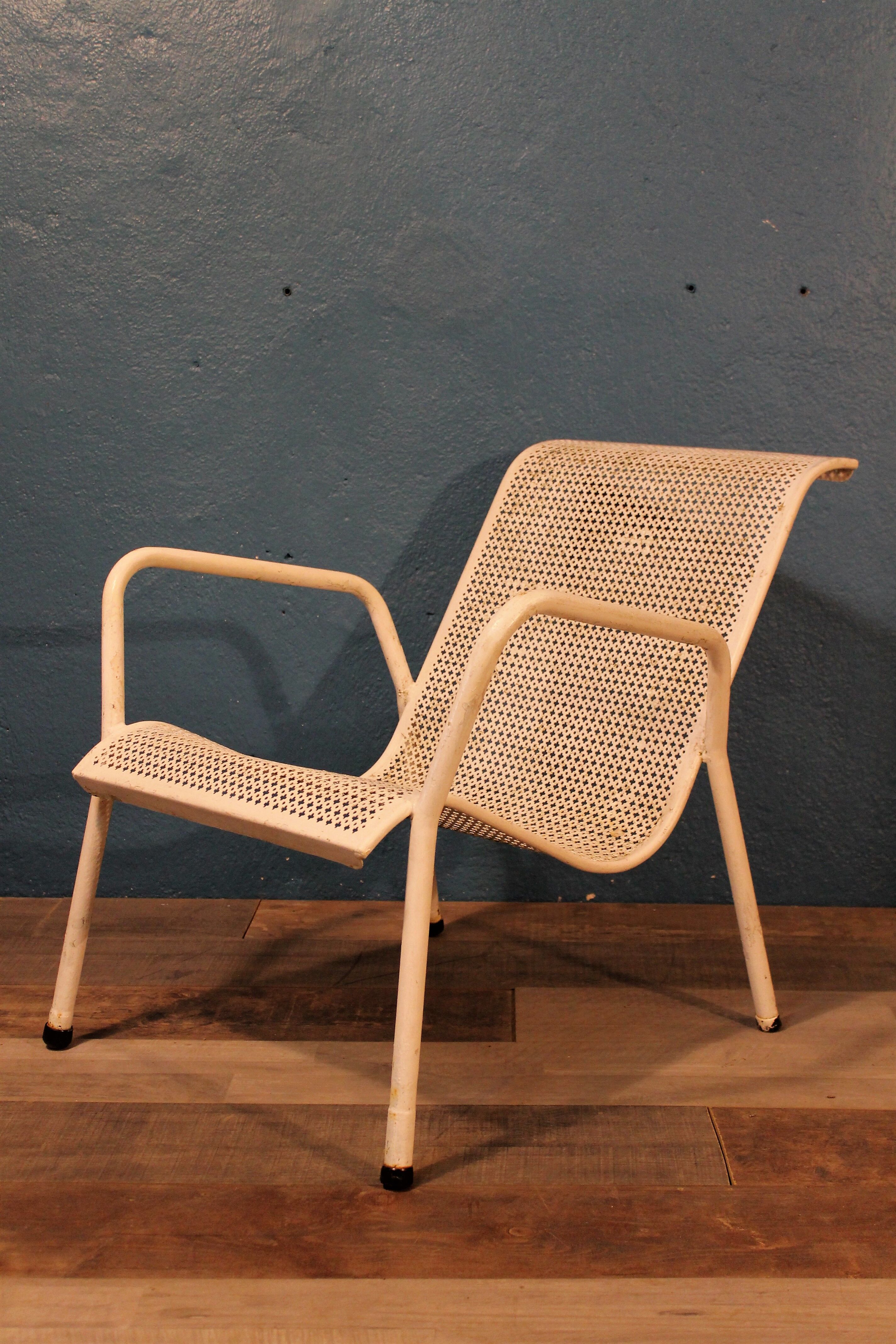 1960 perforated metal garden armchairs