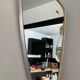 Asymmetrical mirror Deknudt from the 60s