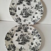 Set of black and white plates in the style of toile de Jouy.