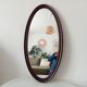 Oval antique mirror in solid wood from the 1960s.