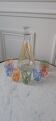 Colorful set consisting of a decanter and 7 70s liqueur glasses