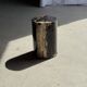 Small side table in black petrified wood with stripes and beige sides H28 D18.