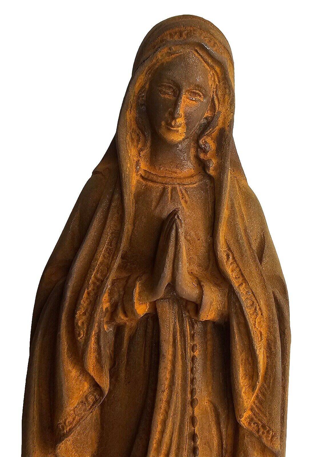 cast iron statue of the virgin