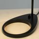 Black table lamp designed by Arne Jacobsen and manufactured by Louis Poulsen