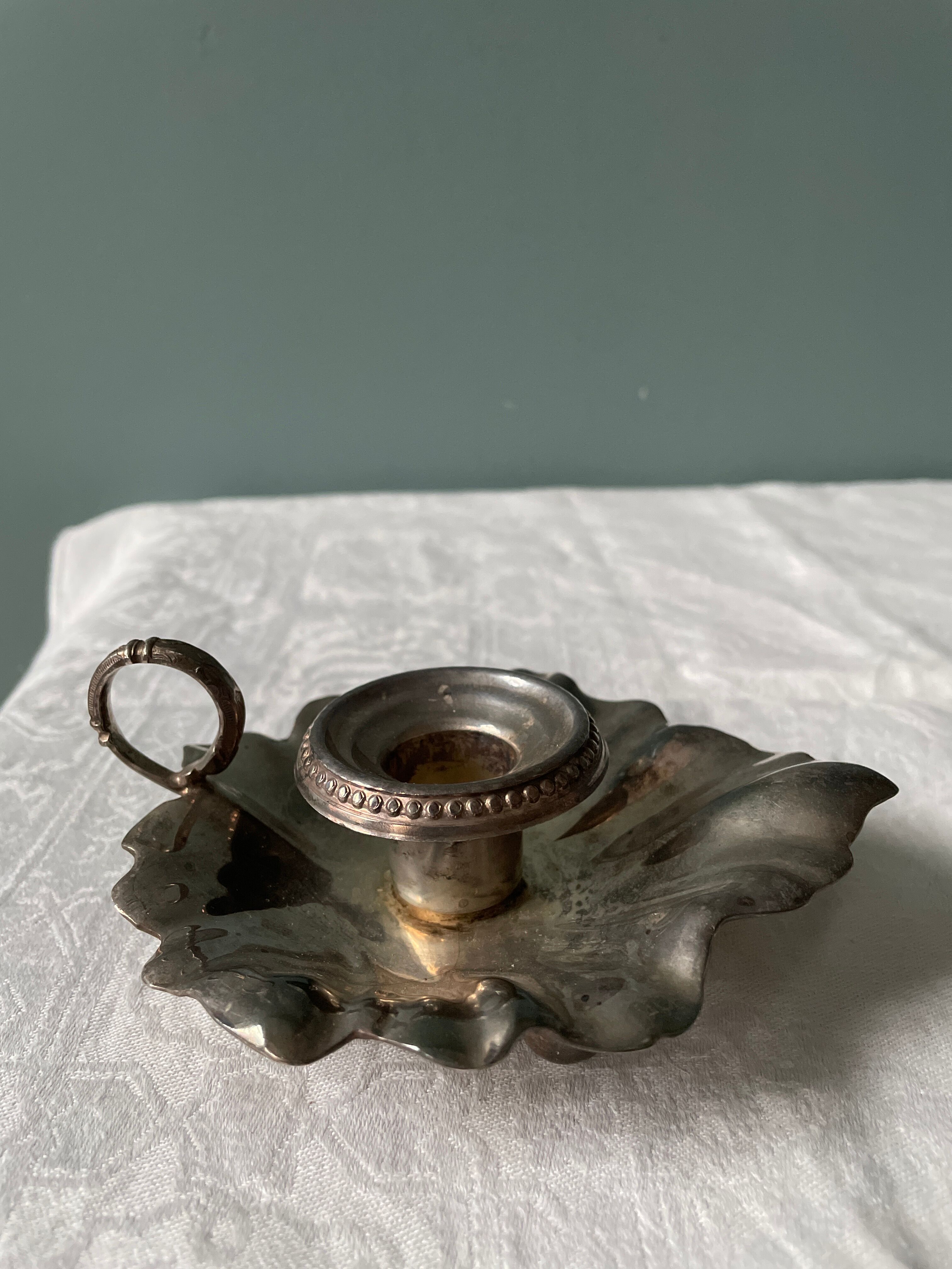 Old leaf-shaped hand candle holder, mid-twentieth