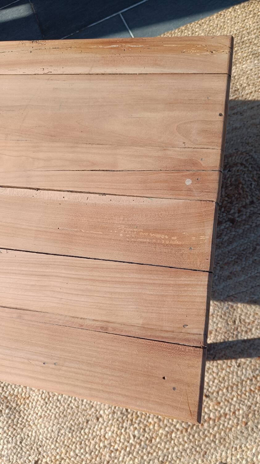 Low farmhouse table in raw wood