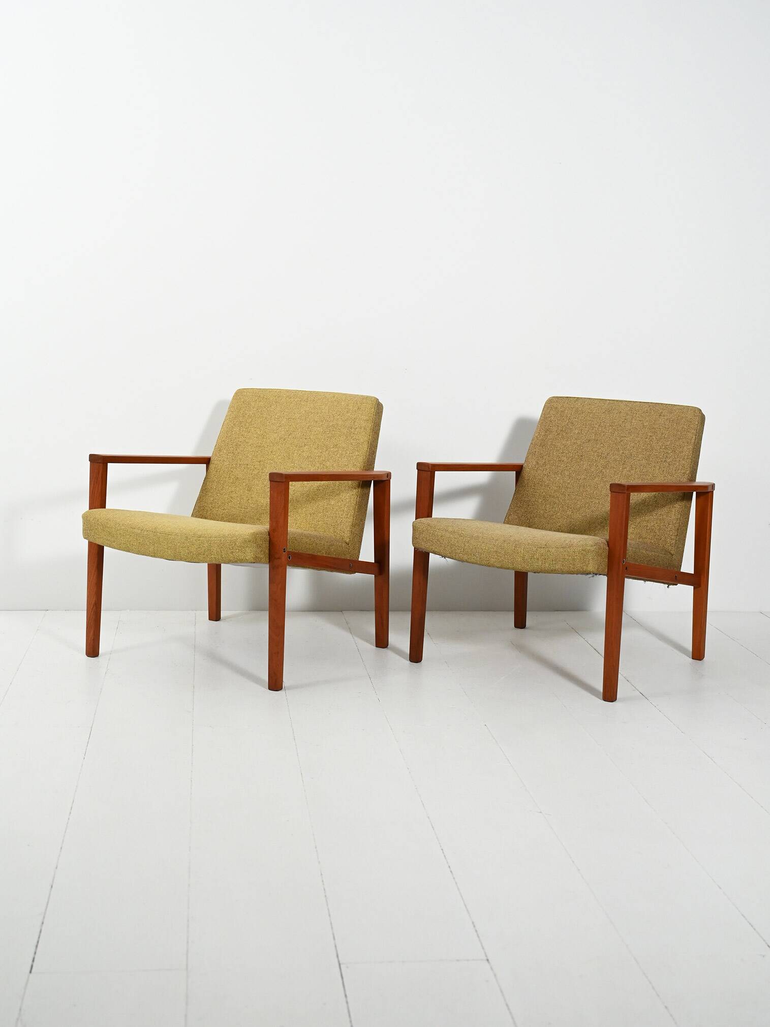 Pair of Danish teak armchairs with green upholstery