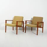 Pair of Danish teak armchairs with green upholstery