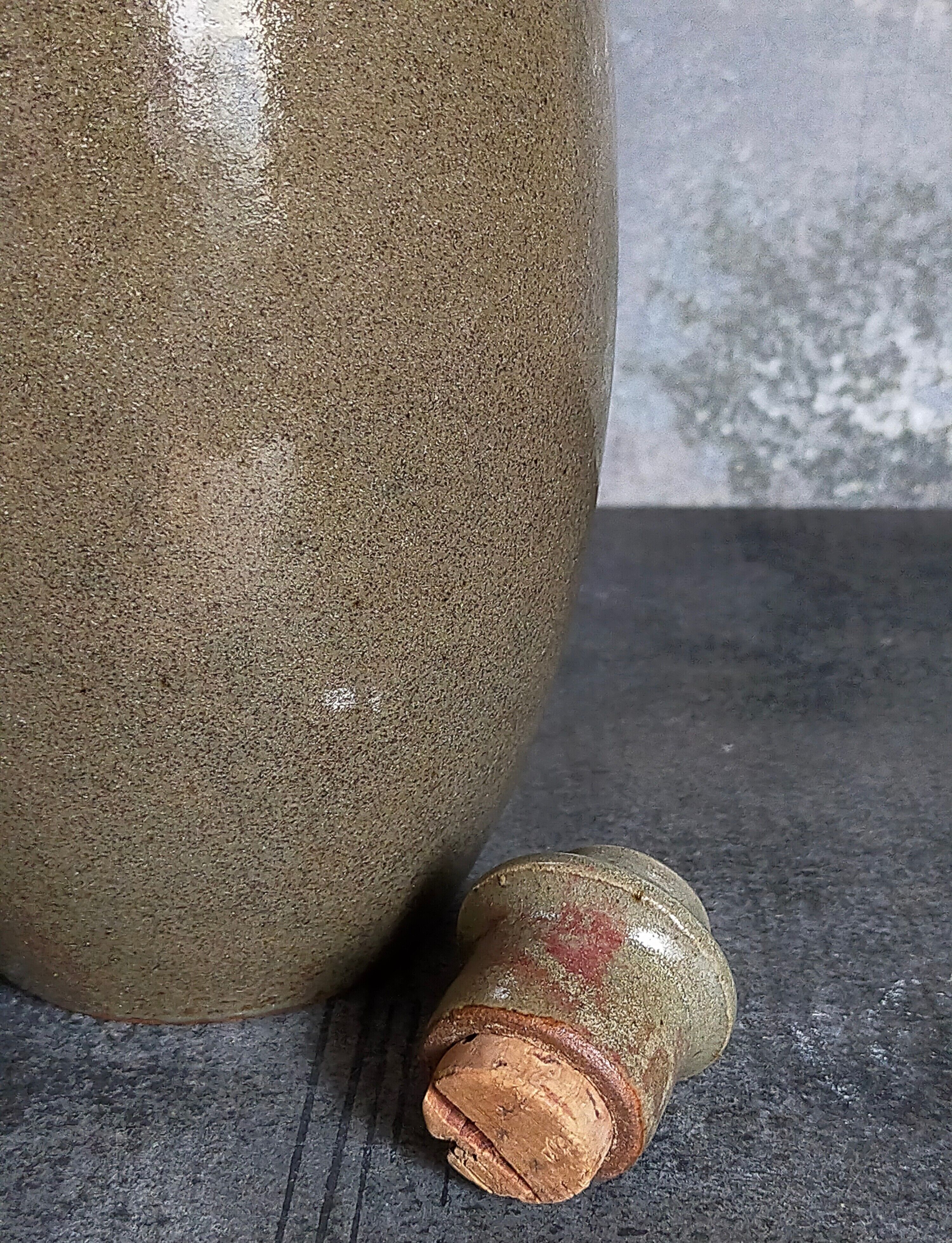 Vintage glazed stoneware potter's liquor bottle