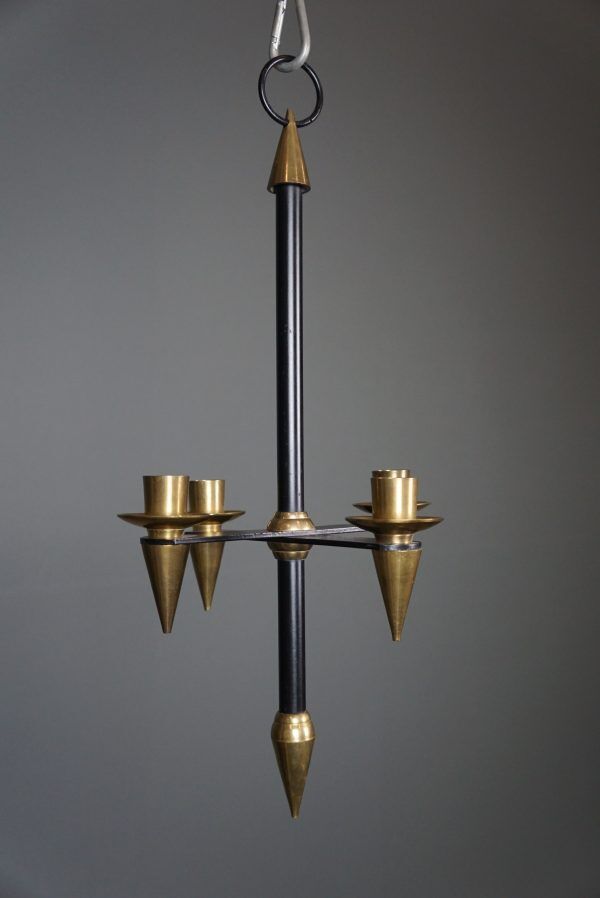 Candle holder in black metal and brass