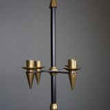 Candle holder in black metal and brass