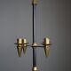 Candle holder in black metal and brass