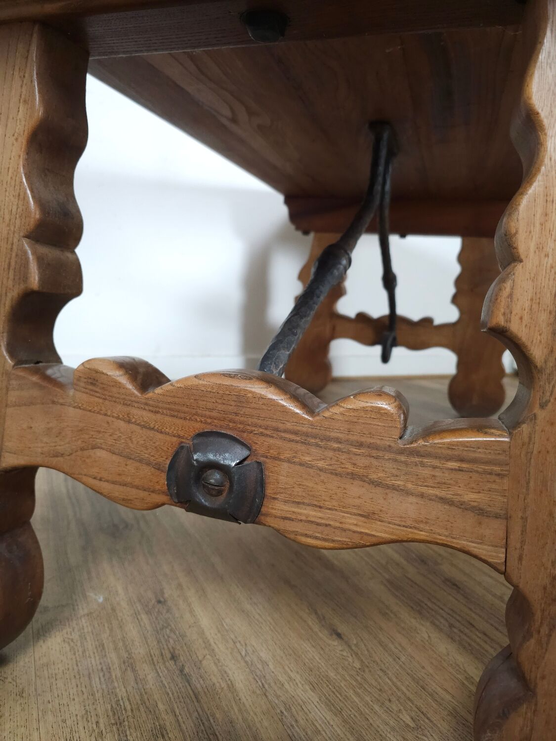 Rustic solid oak table with wrought iron, circa 1950.