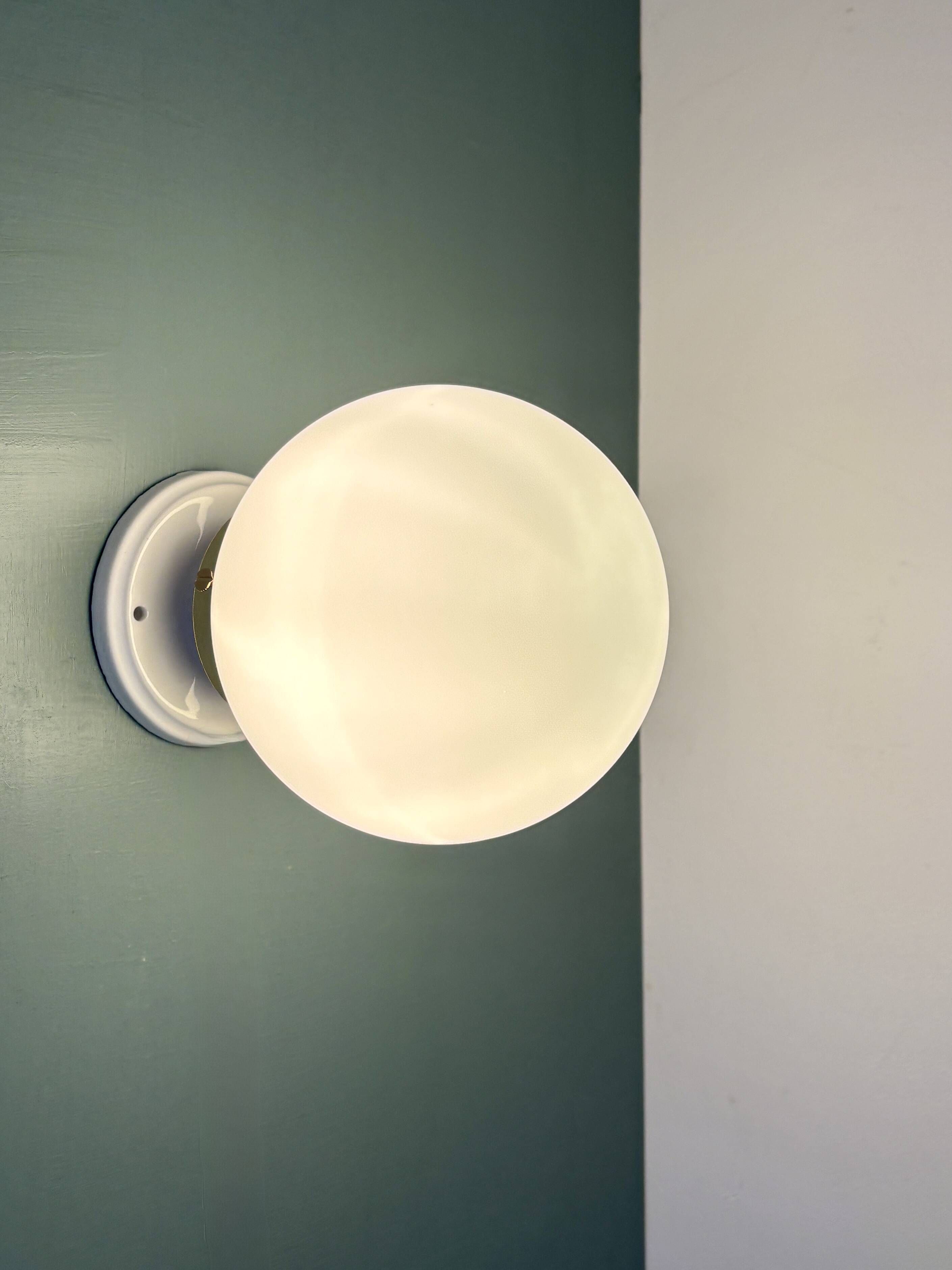Vintage globe wall or ceiling light in white opaline.