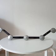 Vintage 1950s wall coat rack, wrought iron with chiselled details and solid aluminium.