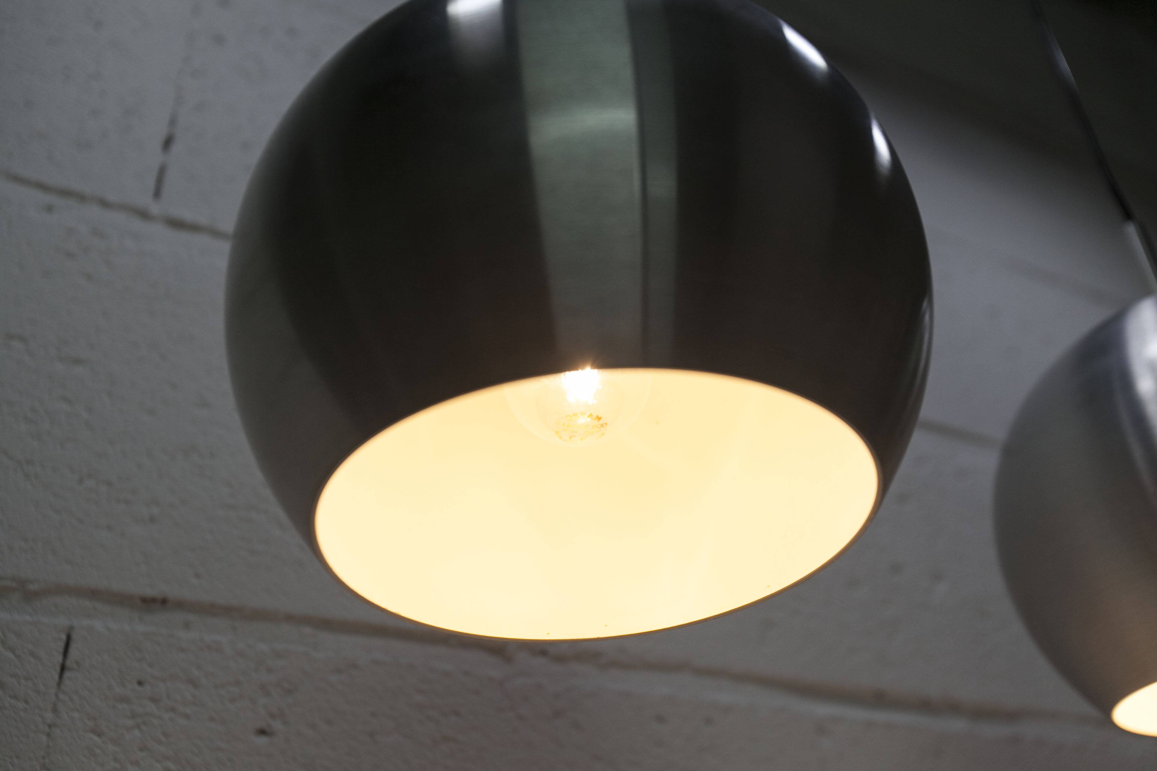 Pair of functional 70's aluminum ball pendants