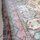 Afghan rug in pastel colors