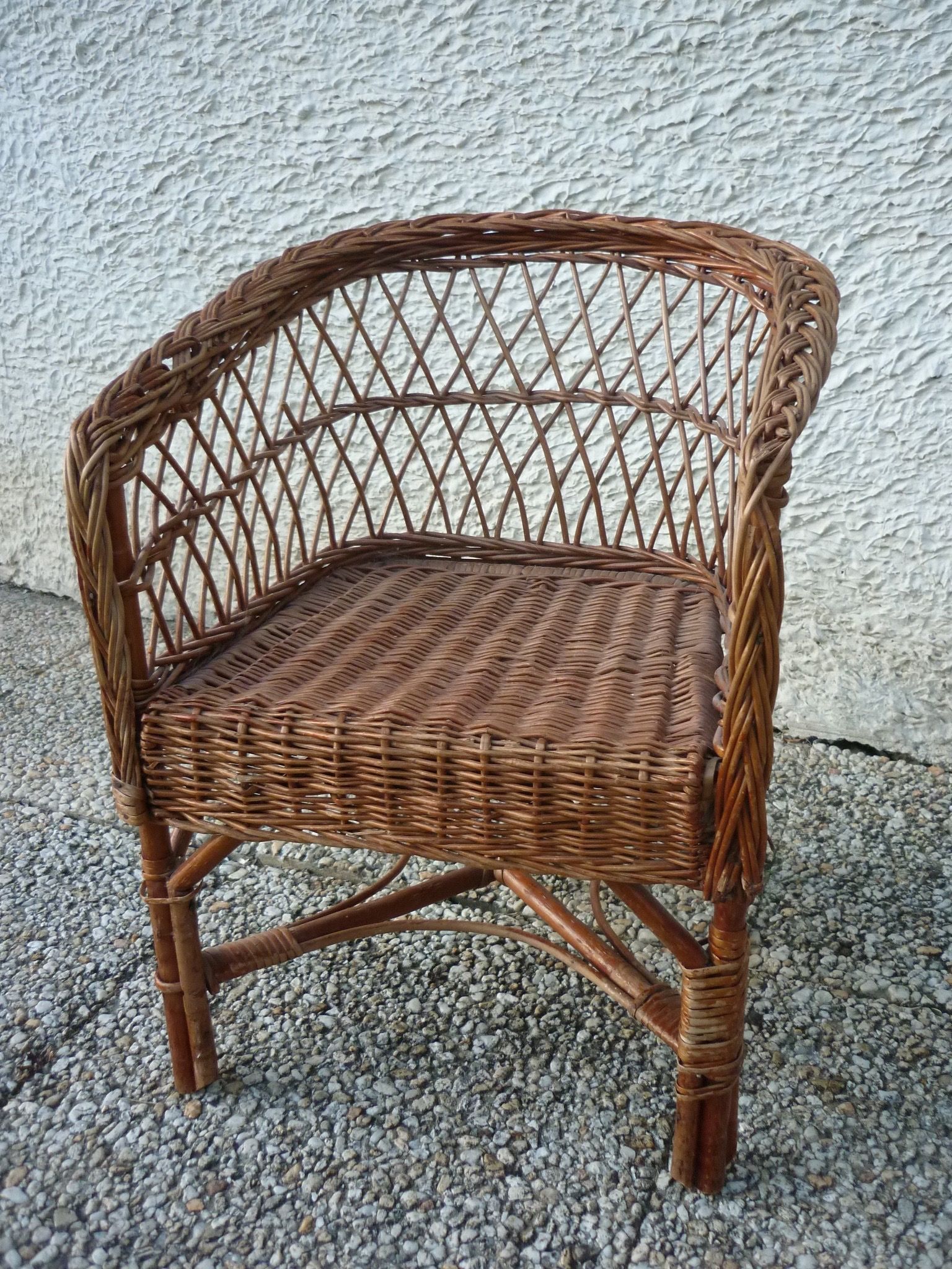 Children's basket chair in vintage braided wicker