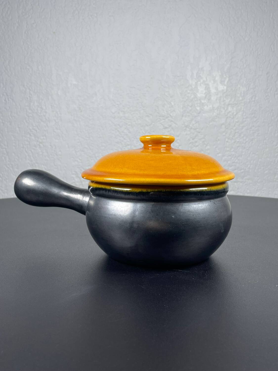 Black and yellow fondue pot