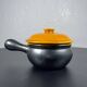 Black and yellow fondue pot