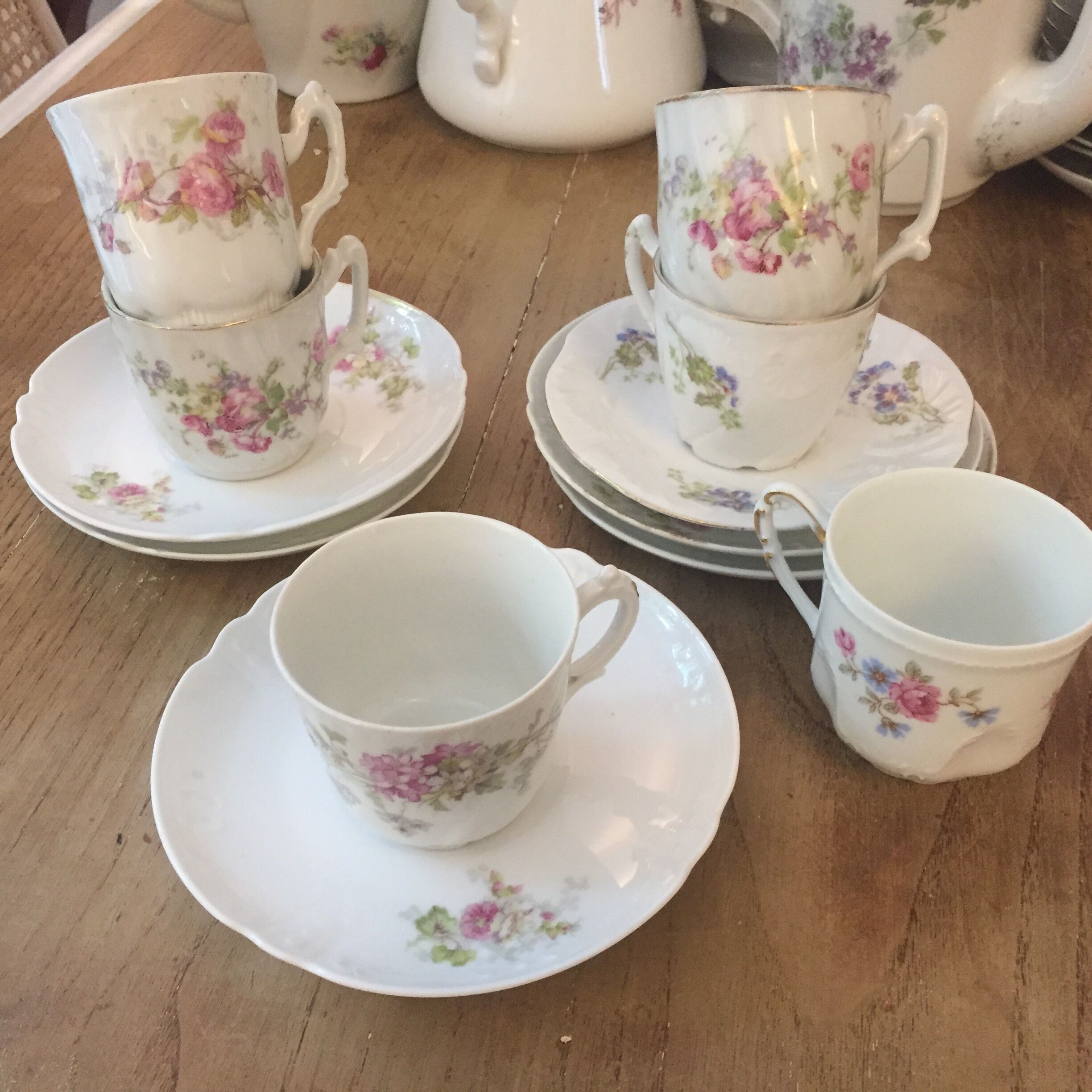 6 antique cups and mismatched saucers