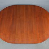 Round teak dinning table and chairs by Mctintosh