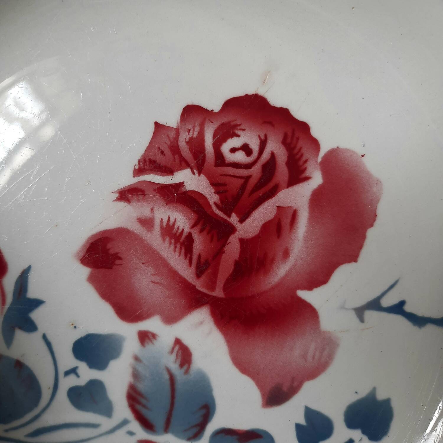 Mismatched old soup plates accompanied by a soup tureen
