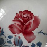 Mismatched old soup plates accompanied by a soup tureen