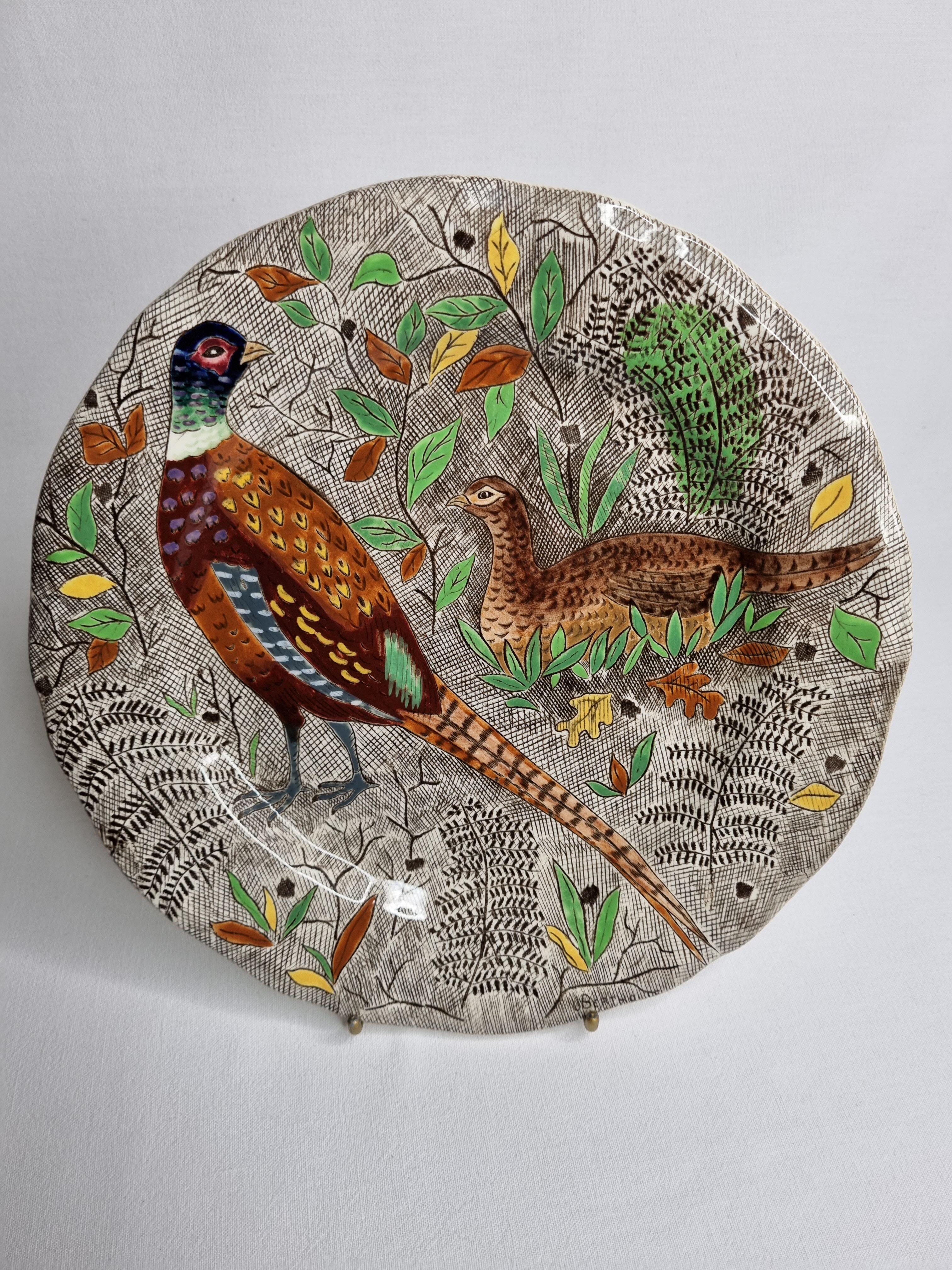 Plate in gien earthenware model rambouillet "couple of pheasants" signed in the décor, 26 cm