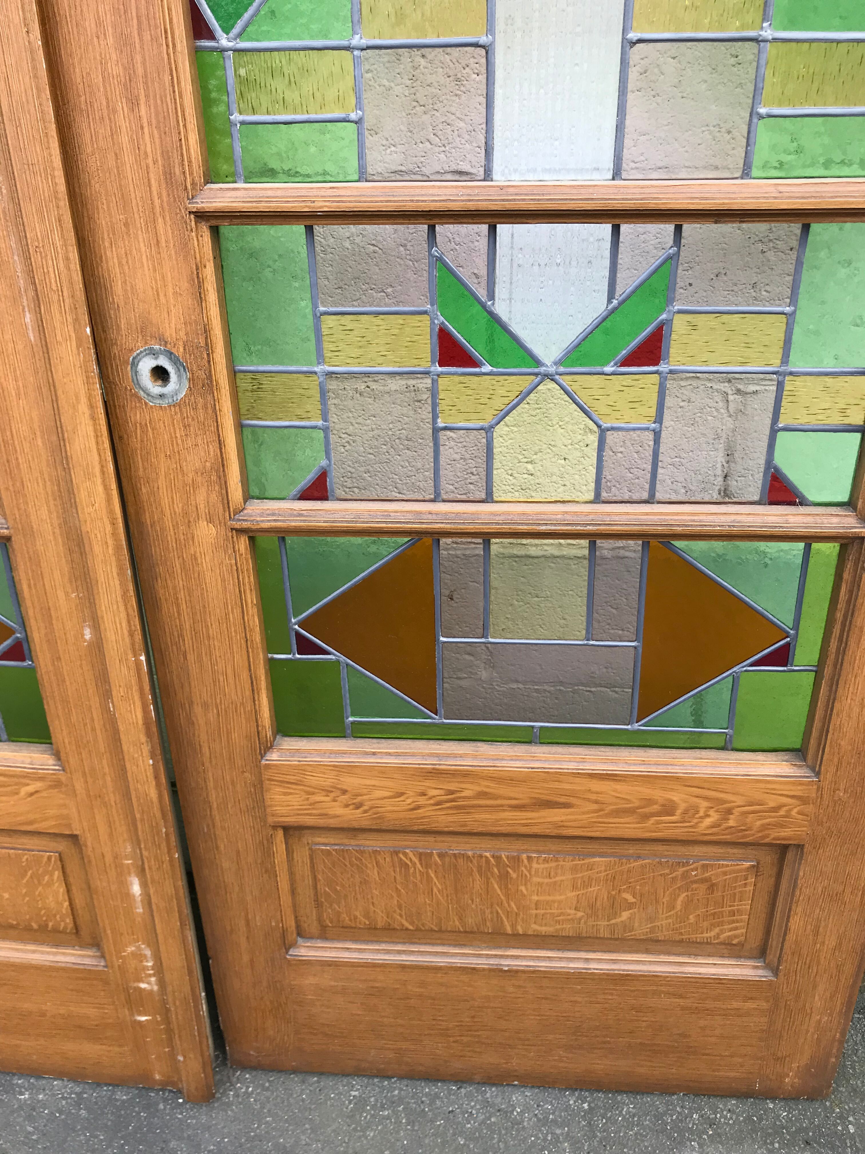 Series of three doors with stained glass windows