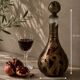 Carafe artisanale en verre soufflé et cuivre patiné décor brutaliste 90 cm