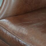 Cognac brown cow leather armchair with decorative nail finish