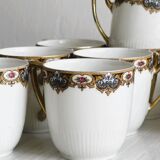 7 Limoges porcelain cups and saucers with gold decoration and floral motif.