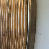 Large round mirror in rattan and brass