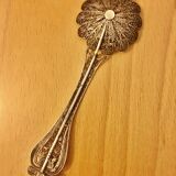 silver sprinkler spoon