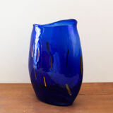 Blue blown glass vase and orange inclusion