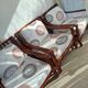 Vintage salon Maison Maugrion in rattan with leather and feather finishes.