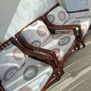 Vintage salon Maison Maugrion in rattan with leather and feather finishes.