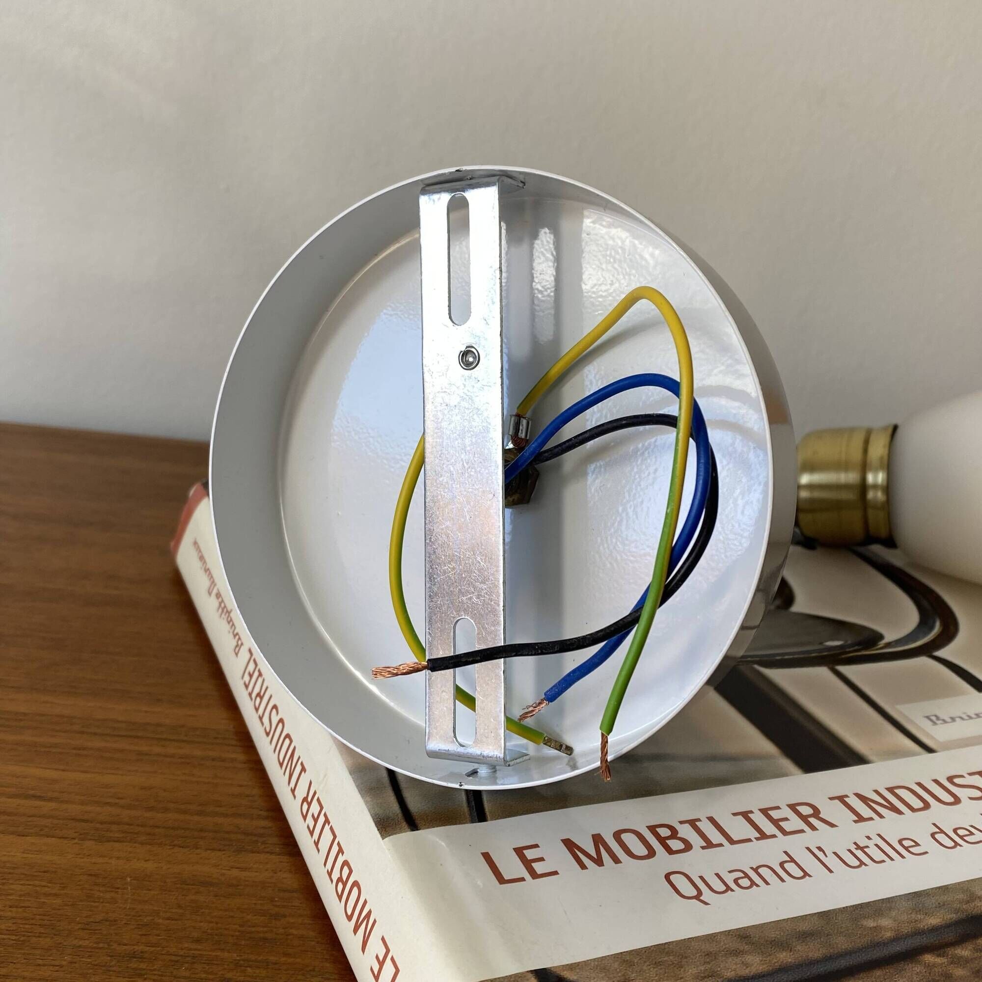 Pair of brass swan neck wall lights with white glass shades.