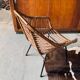 Rattan armchair and black metal base 1960