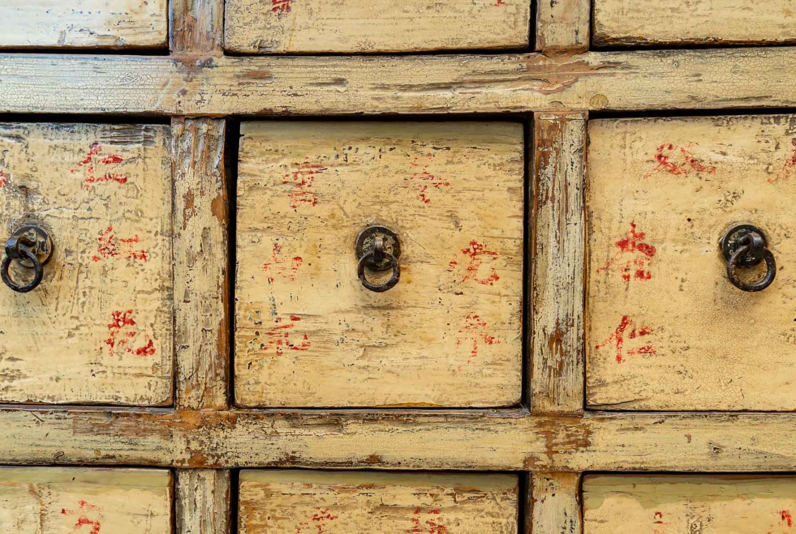Antique Chinese apothecary cabinet with calligraphy